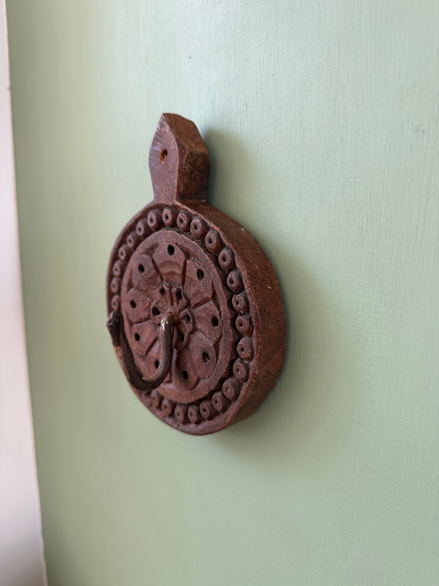 Hand-carved wooden wall hook from India