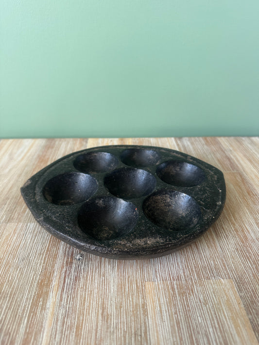 Hand-carved stone Idli plate from India.
