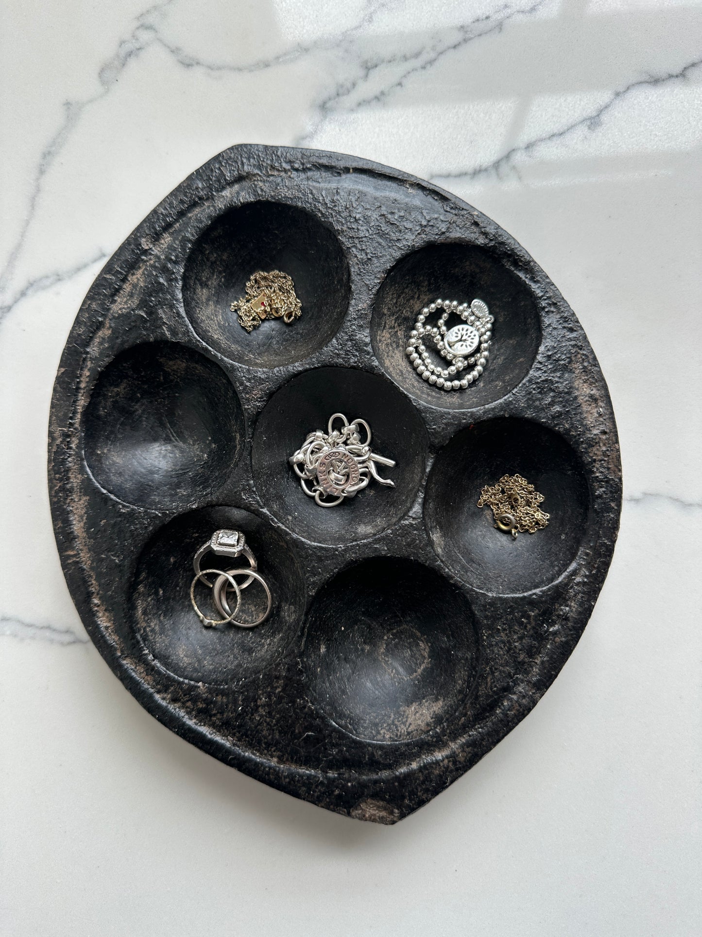Hand-carved stone Idli plate from India.