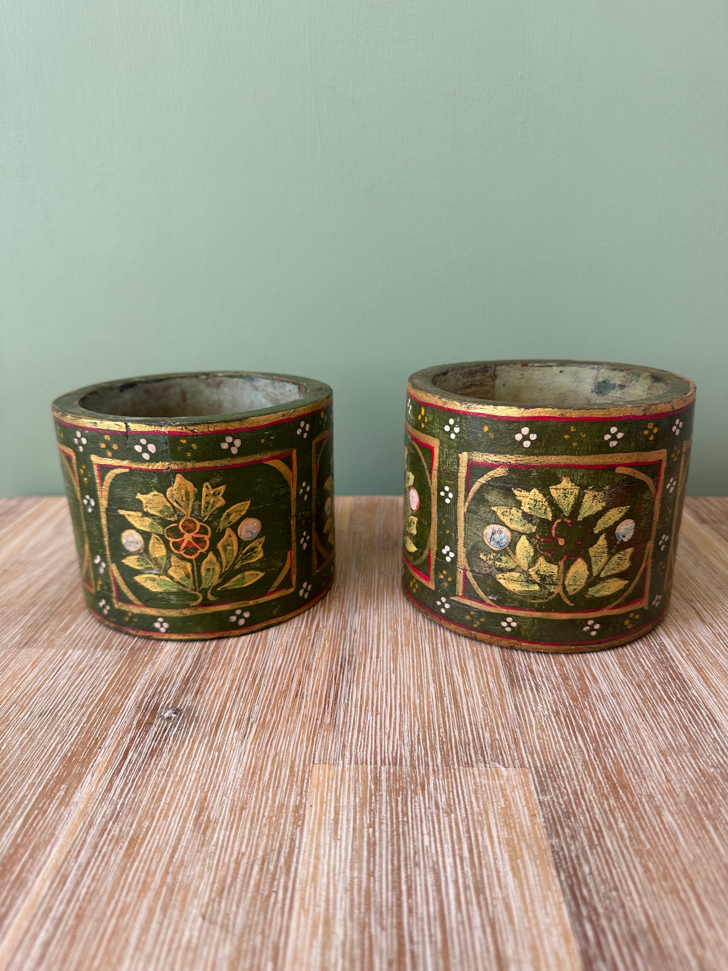 Pair of green wooden holders
