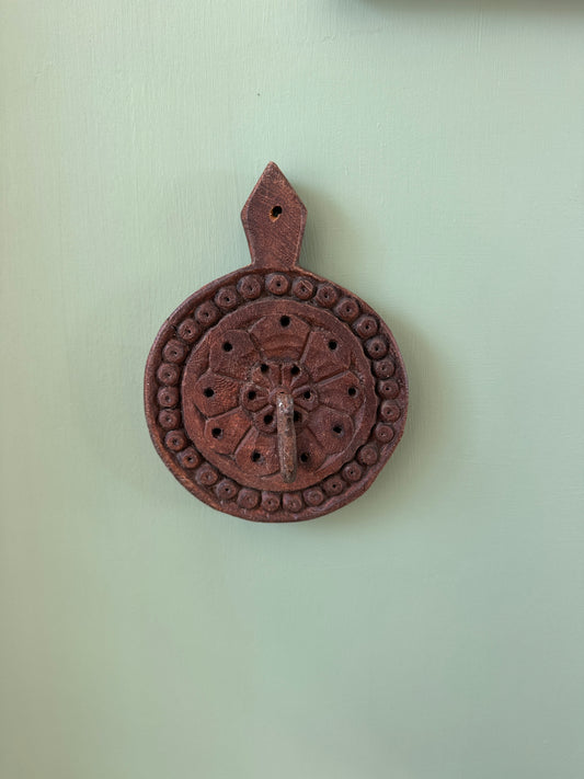 Hand-carved wooden wall hook from India