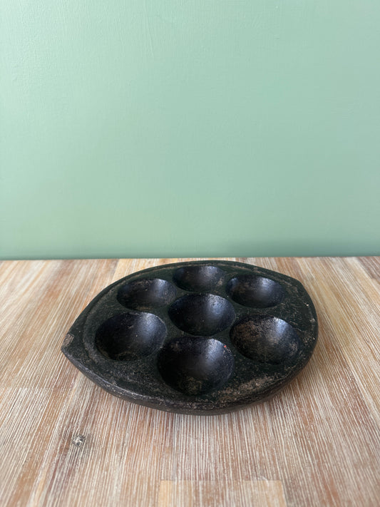 Hand-carved stone Idli plate from India.
