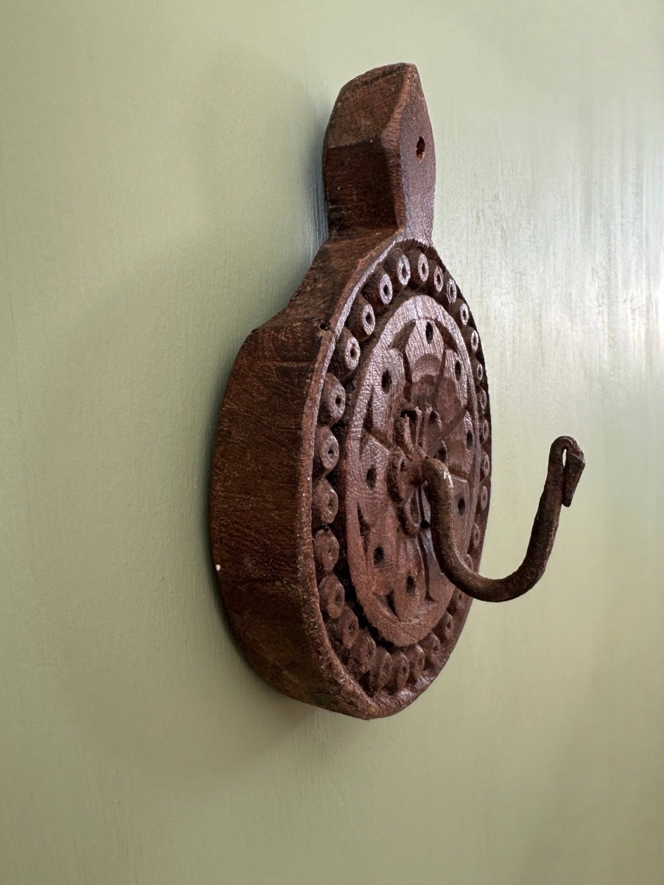 Hand-carved wooden wall hook from India