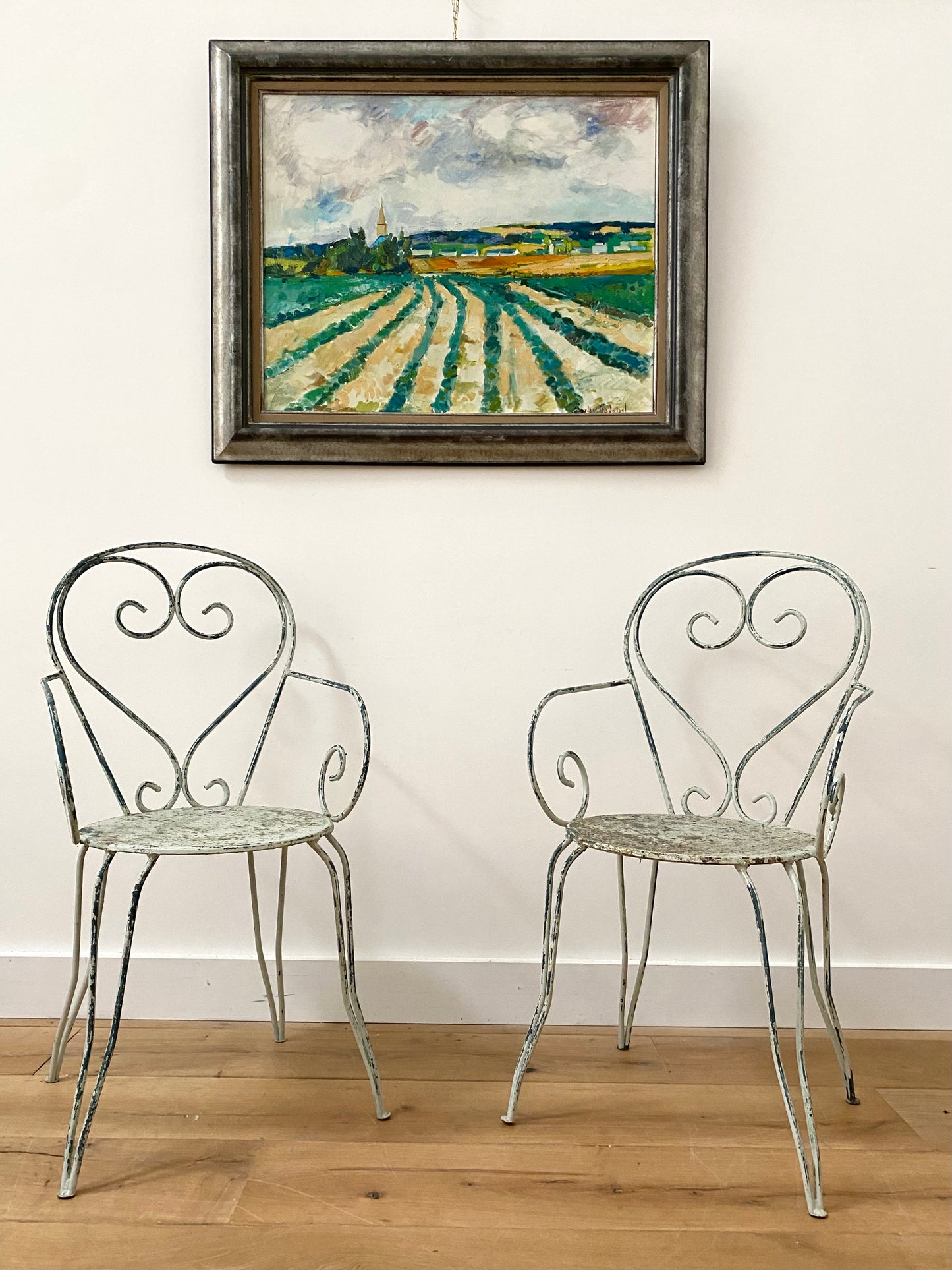 A Pair Of Wrought Iron Garden Armchairs