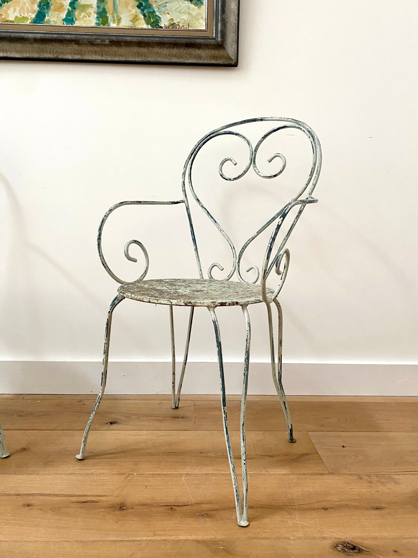 A Pair Of Wrought Iron Garden Armchairs
