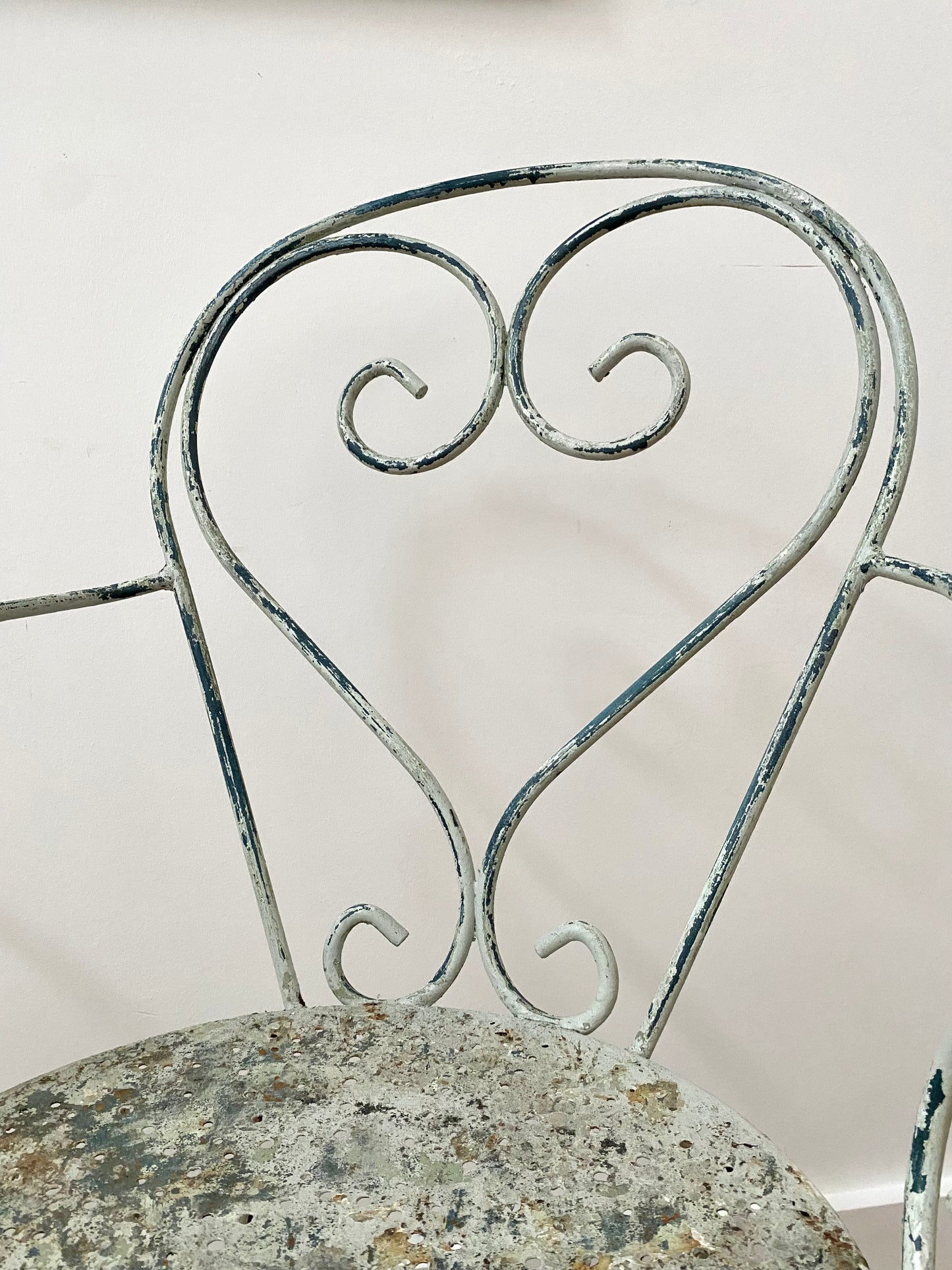 A Pair Of Wrought Iron Garden Armchairs